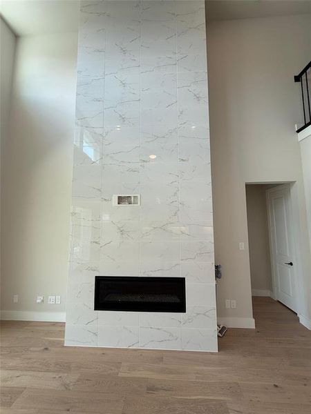 Detailed view of a high end fireplace and wood finished floors Detailed view of a high end fireplace and wood finished floors