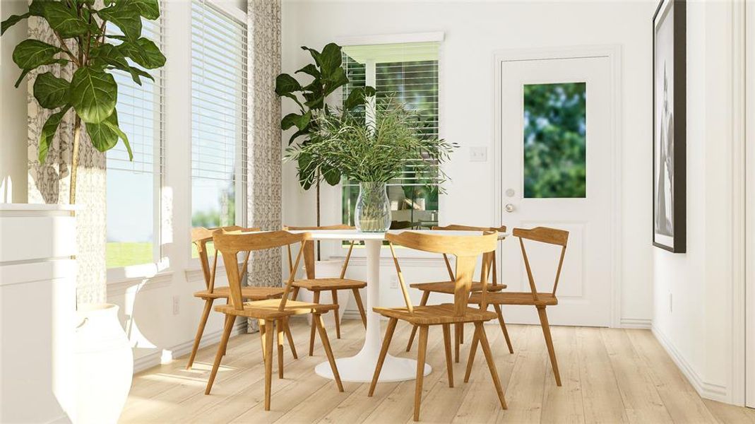 Dining space with light hardwood / wood-style floors