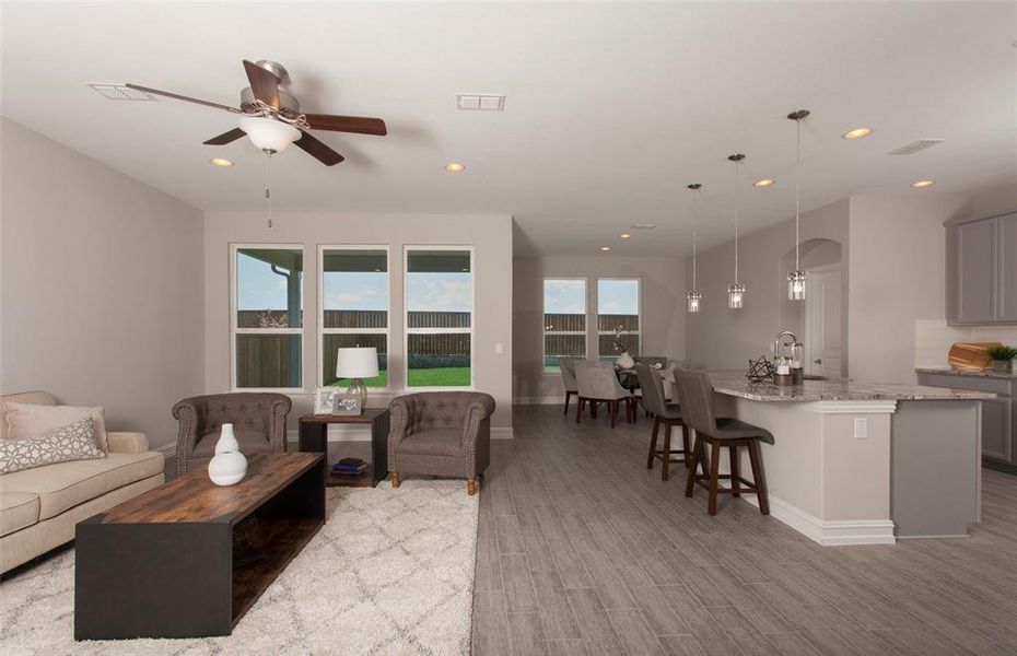 *Model Representation - Spacious gathering room with large windows