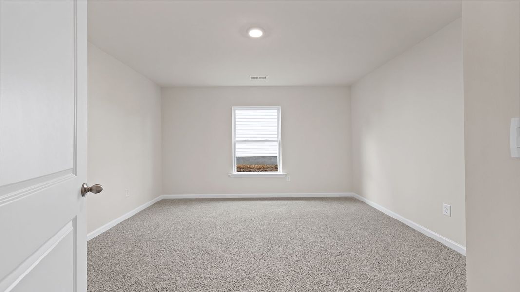 Spacious, unfurnished interior of a new home in Bentley Park, Greenwood (Image 17).