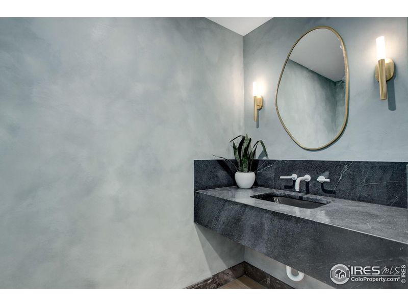 Powder room featuring a floating Mitered Marine Black Soapstone with Portola Lime Wash Paint