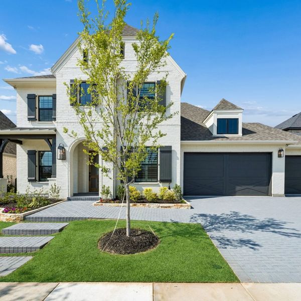 Front exterior of a new home in Mosaic – 70′ Lots, Prosper, TX, highlighting curb appeal (Image 2). Front exterior of a new home in Mosaic – 70′ Lots, Prosper, TX, highlighting curb appeal (Image 2).