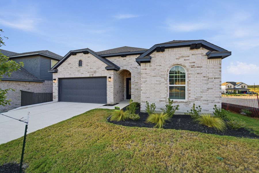 Front exterior of a new home in The Woodlands at Medina Hills, Mico, TX, highlighting curb appeal (Image 22).