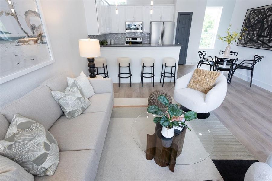 Living room with light hardwood / wood-style flooring