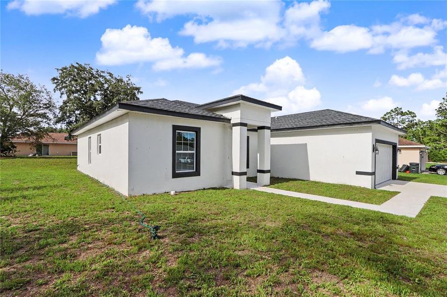 Front exterior of a new home in , Ocala, FL, highlighting curb appeal (Image 32).