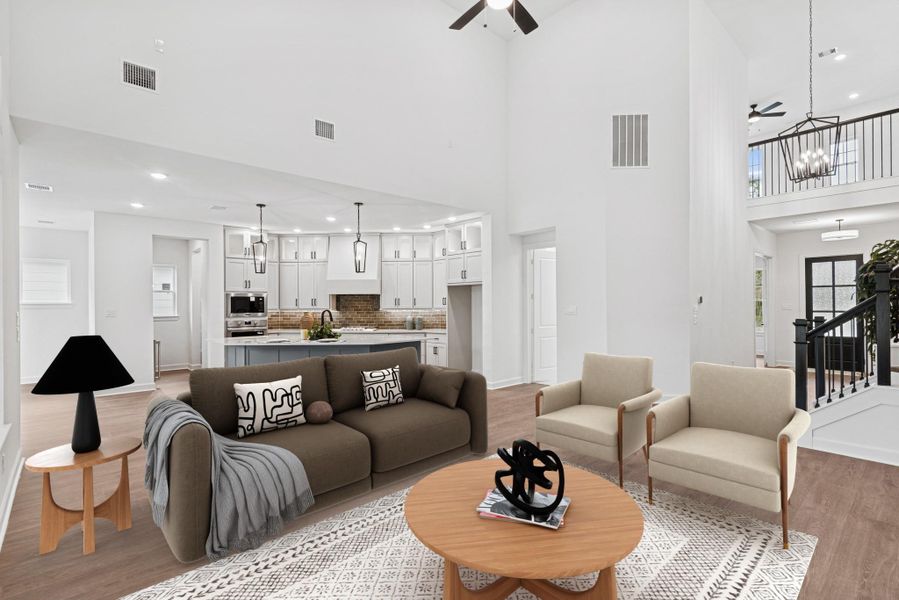 Example of how your furniture could fit into this home. Spacious Living area with dramatic high ceilings!