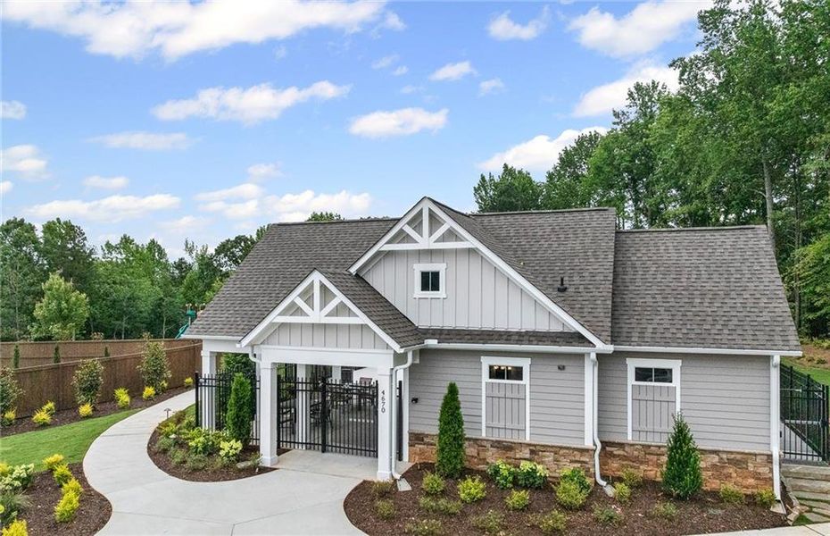 Front exterior of a new home in Hunters Creek, Flowery Branch, GA, highlighting curb appeal (Image 2). Front exterior of a new home in Hunters Creek, Flowery Branch, GA, highlighting curb appeal (Image 2).