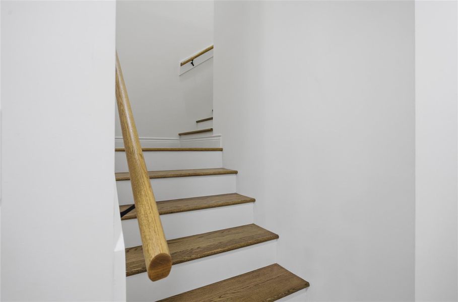 Thoughtfully designed staircase with refined wood details.