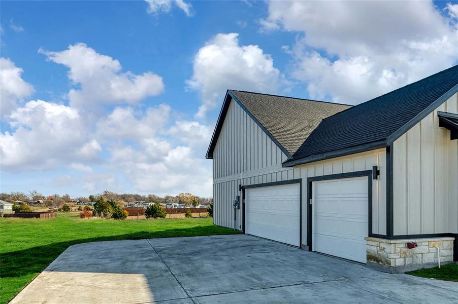 Garage featuring a yard