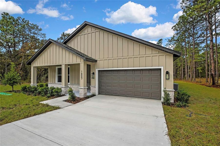 Front exterior of a new home in , Weeki Wachee, FL, highlighting curb appeal (Image 32).