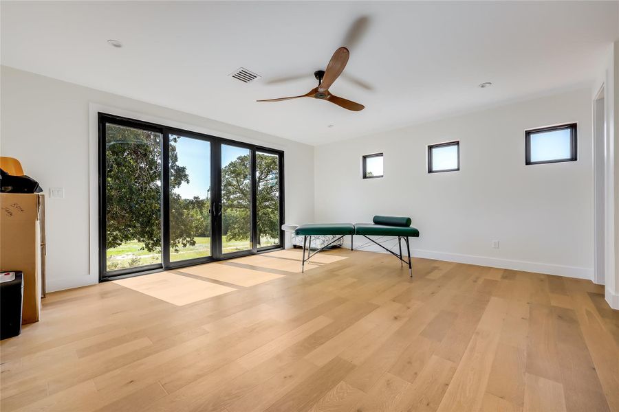 Game room featuring light wood-style floors and ceiling fan