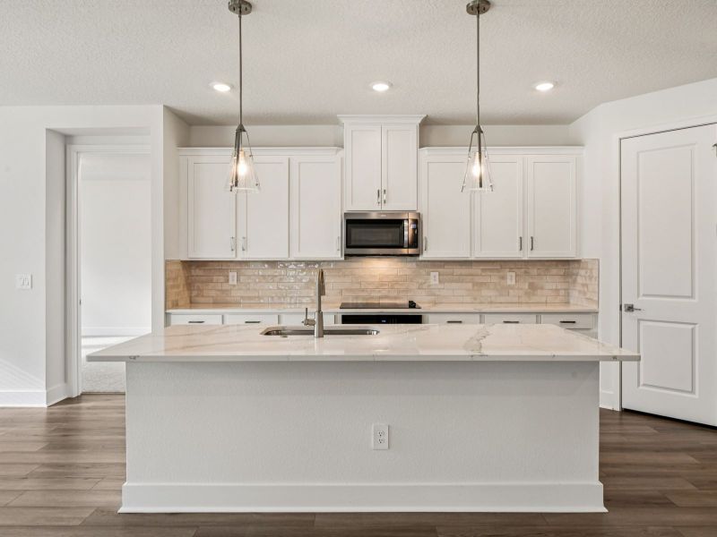 Furnished interior view inside a new home in Legends Preserve - Signature Series, Daytona Beach (Image 3).