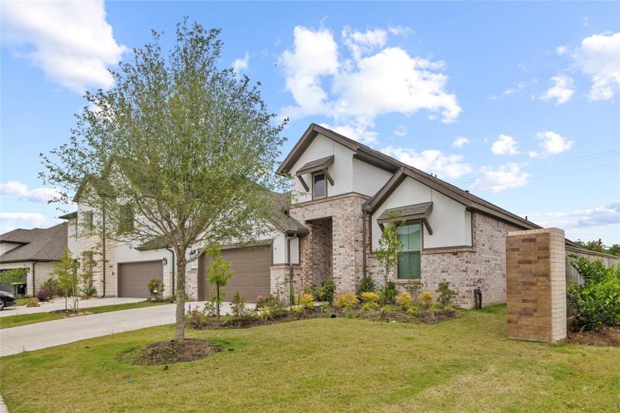 Front exterior of a new home in Candela, Richmond, TX, highlighting curb appeal (Image 23).