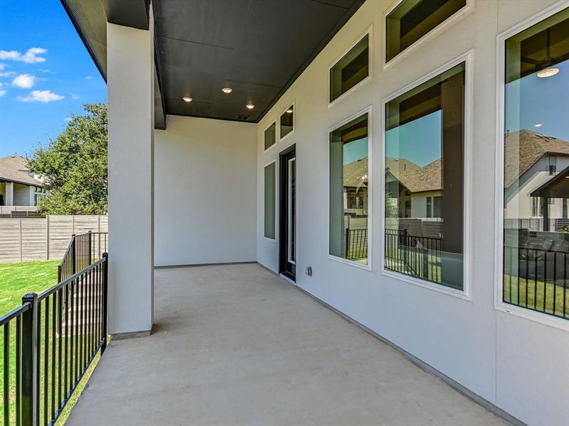 Check out this large covered patio!  Plenty of space for an outdoor dining table and sitting area.