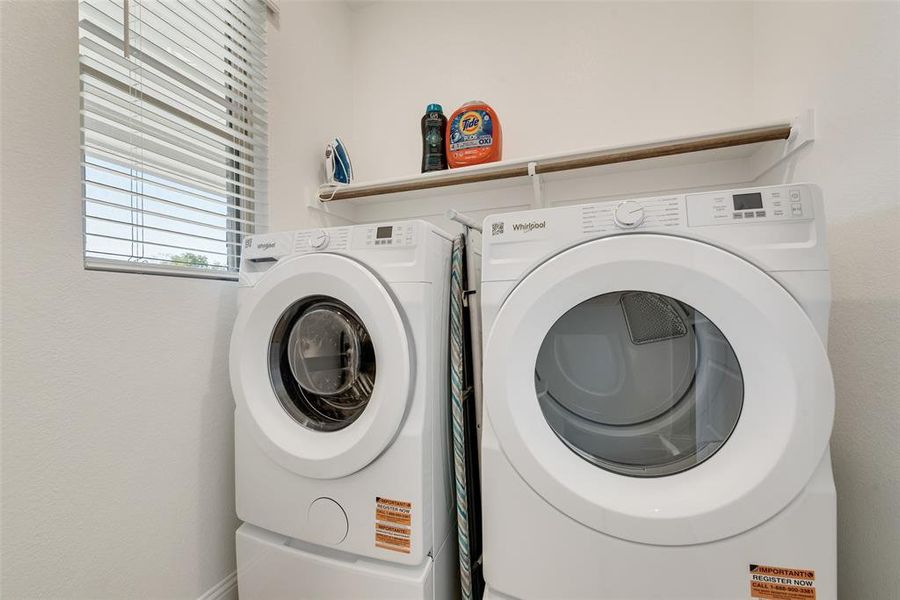 Washroom featuring washing machine and dryer that will convey with the home! Washroom featuring washing machine and dryer that will convey with the home!
