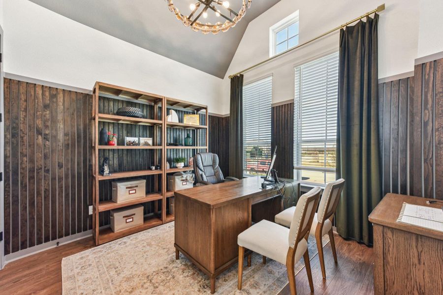 Rich wood paneling and vaulted ceilings define this professional workspace.
