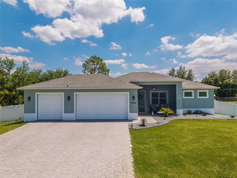 Front exterior of a new home in , Lehigh Acres, FL, highlighting curb appeal (Image 27).