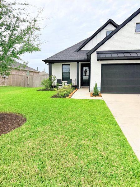 Front exterior of a new home in , Richmond, TX, highlighting curb appeal (Image 21).