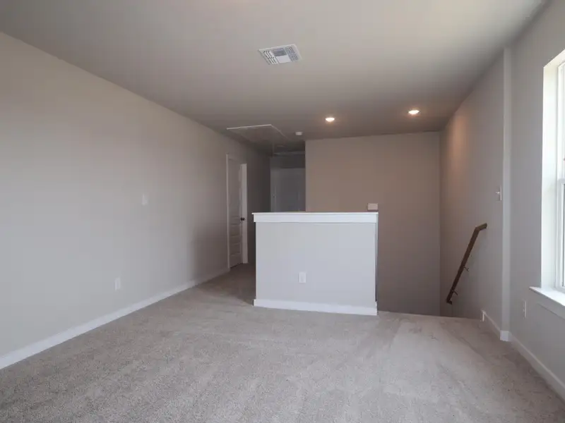 Spacious, unfurnished interior of a new home in Heritage, Dripping Springs (Image 5).
