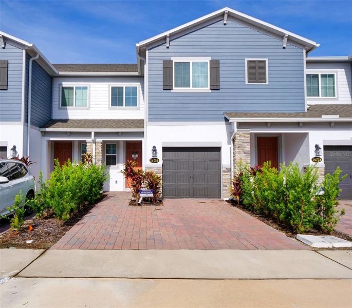 Front exterior of a new home in , Orlando, FL, highlighting curb appeal (Image 18).