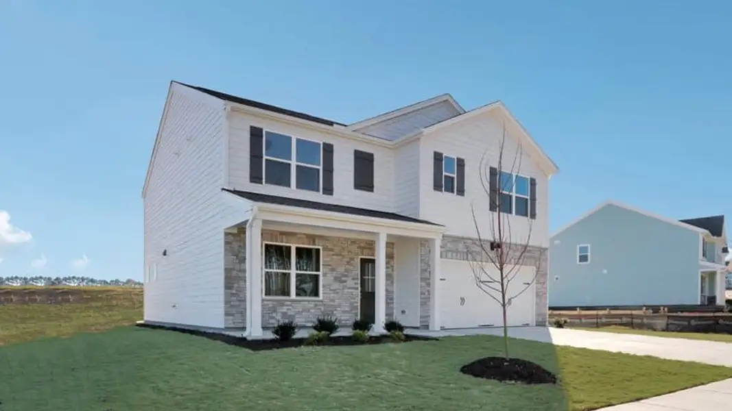 Front exterior of a new home in The Landing at Winston Pointe, Clayton, NC, highlighting curb appeal (Image 2). Front exterior of a new home in The Landing at Winston Pointe, Clayton, NC, highlighting curb appeal (Image 2).