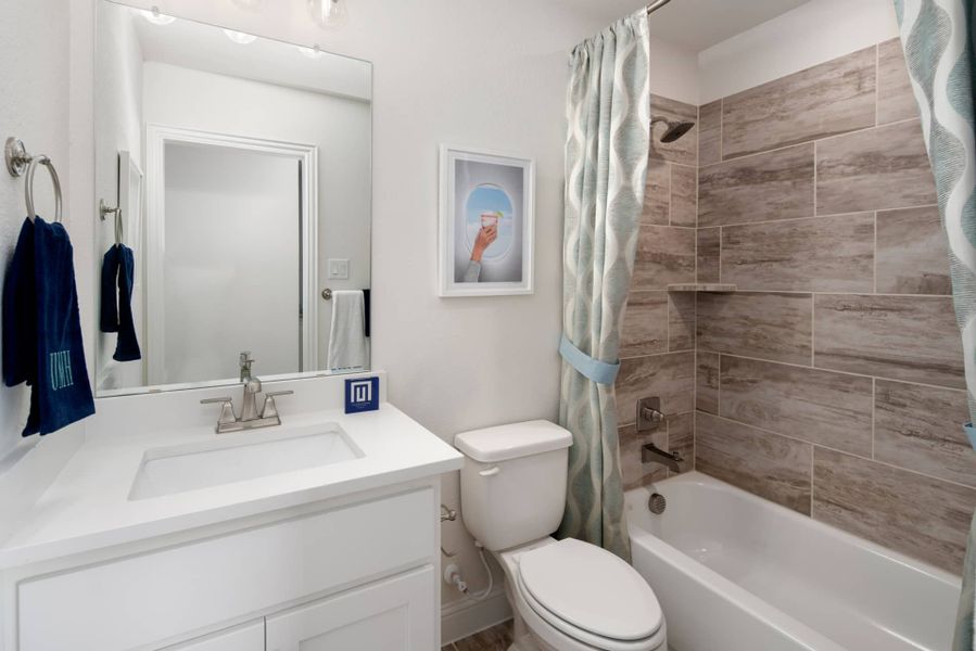 Representative furnished interior of a home built from the The Trinity Executive by UnionMain Homes in Lake Breeze, Lavon (Image 41).