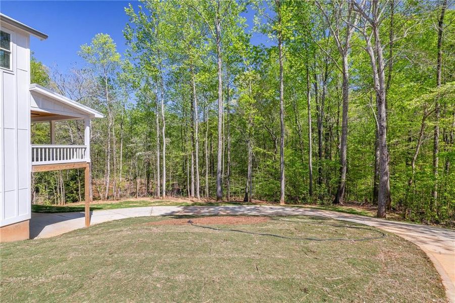 Front exterior of a new home in , Flowery Branch, GA, highlighting curb appeal (Image 2).