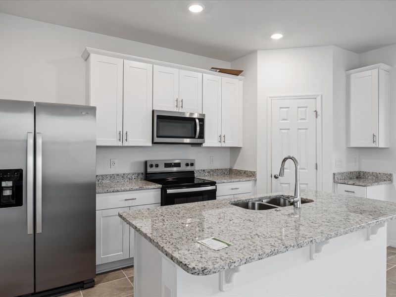 Kitchen in the Austen floorplan at 4653 Cross Prairie Parkway