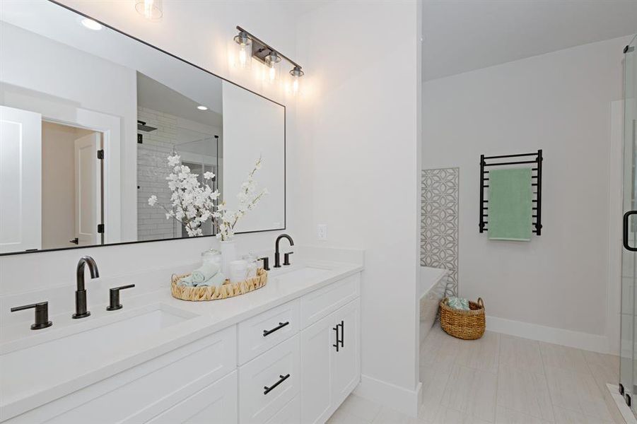 A spa-inspired Owner’s Suite Bathroom with Dual Vanities and Fully Extendable Soft Close Drawers and Deep Cabinets are just a few of the elegant details. A spa-inspired Owner’s Suite Bathroom with Dual Vanities and Fully Extendable Soft Close Drawers and Deep Cabinets are just a few of the elegant details.