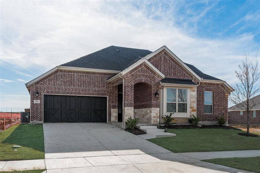 Front exterior of a new home in Arbors at Legacy Hills, Celina, TX, highlighting curb appeal (Image 22).