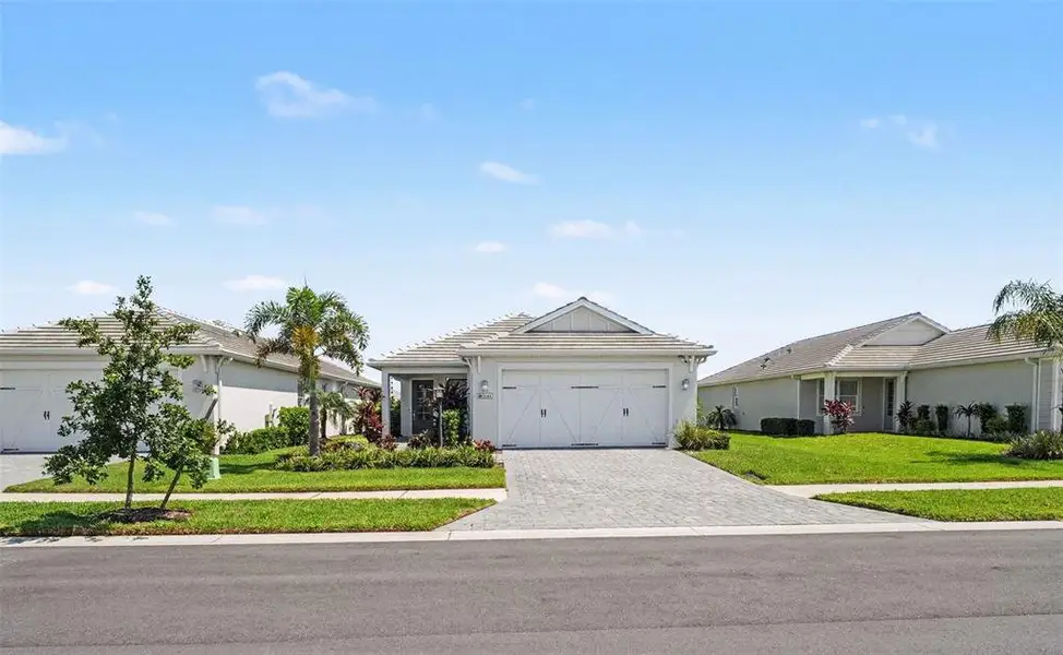 Front exterior of a new home in , Sarasota, FL, highlighting curb appeal (Image 21). Front exterior of a new home in , Sarasota, FL, highlighting curb appeal (Image 21).