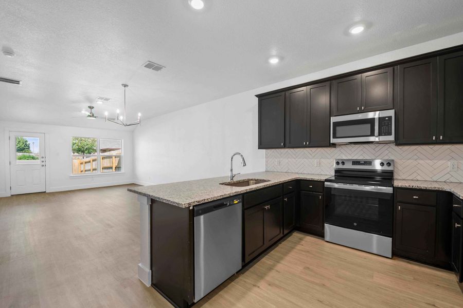 Furnished interior view inside a new home in College Park Townhomes, Troy (Image 3).