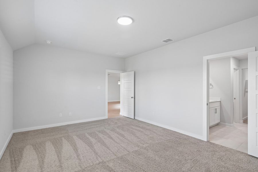 Primary Bedroom in the Hayden home plan by Trophy Signature Homes
