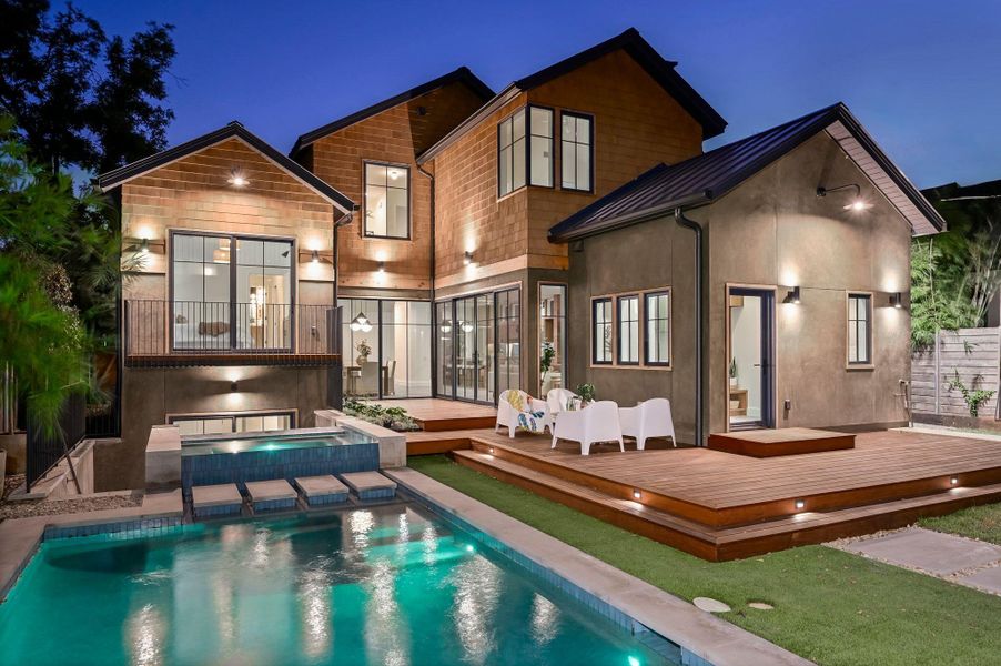 Outdoor pool with a deck, a patio area, and an in-ground hot tub Outdoor pool with a deck, a patio area, and an in-ground hot tub
