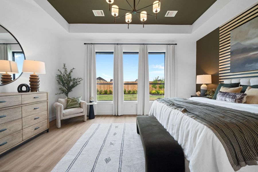 Primary bedroom *Representative photo of a furnished model of the same plan*