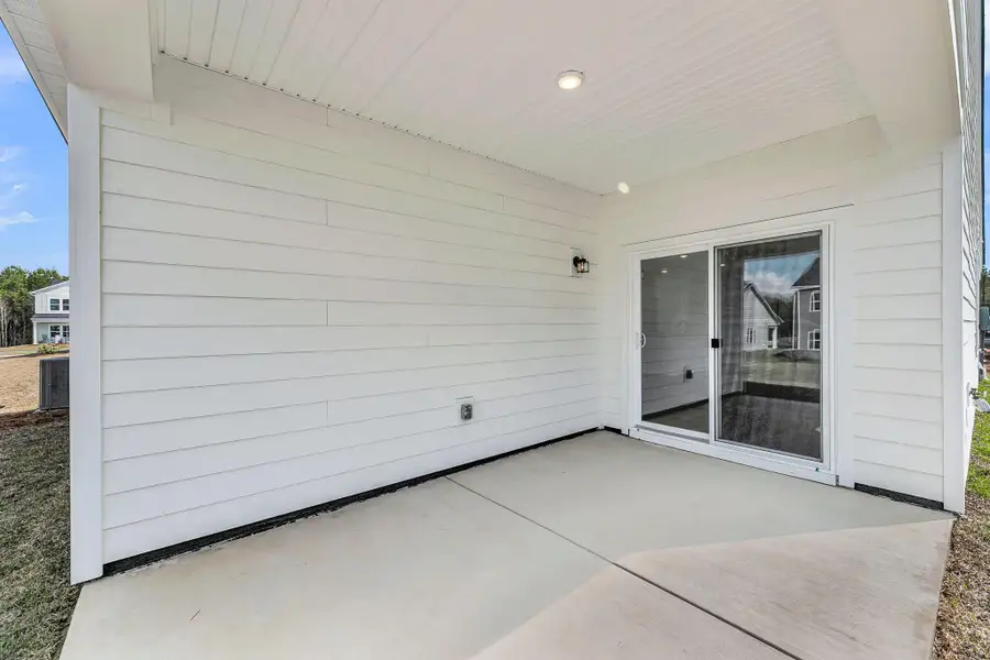 Exterior details and patio area of a home in , Ravenel (Image 3).