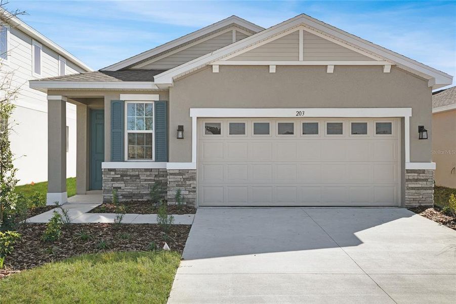 Front exterior of a new home in Seasons at Magnolia Pointe, Umatilla, FL, highlighting curb appeal (Image 2).
