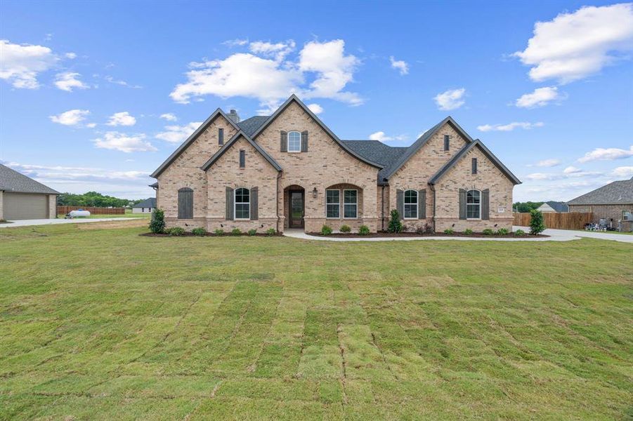 Front exterior of a new home in , Paradise, TX, highlighting curb appeal (Image 1).
