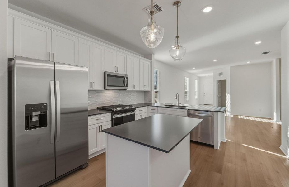 Furnished interior view inside a new home in Crosswinds, Kyle (Image 6).