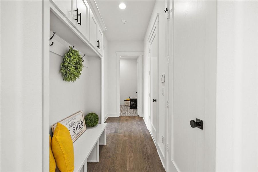 Mudroom with dark hardwood / wood-style floors