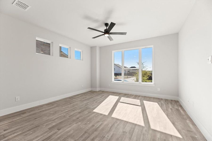 This goregous home provides walls of windows to let the sunshine in!