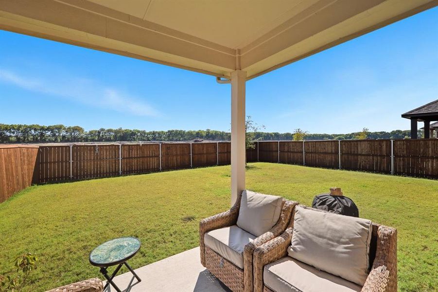 Fenced backyard with a patio Fenced backyard with a patio