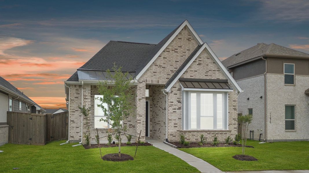 Front exterior of a new home in Riceland, Mont Belvieu, TX, highlighting curb appeal (Image 21). Front exterior of a new home in Riceland, Mont Belvieu, TX, highlighting curb appeal (Image 21).