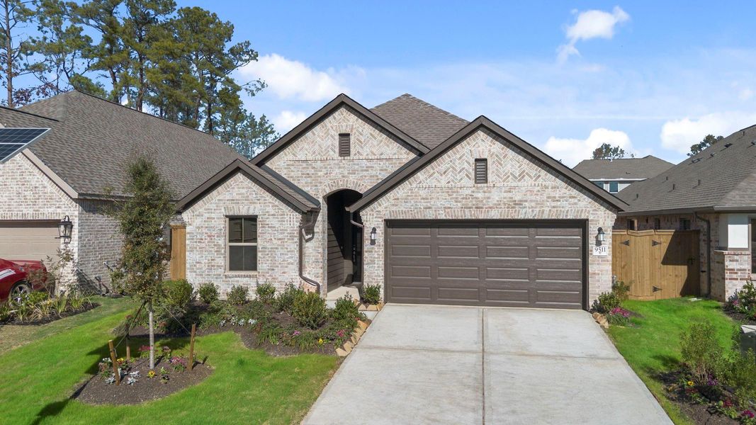 Front exterior of a new home in The Highlands 45', Porter, TX, highlighting curb appeal (Image 20).