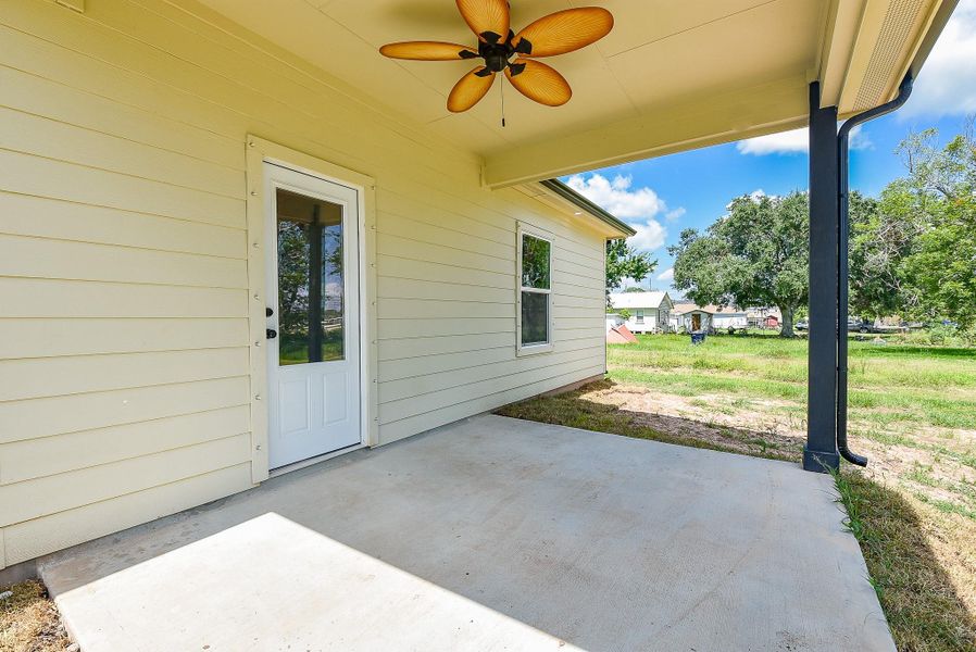 Front exterior of a new home in , West Columbia, TX, highlighting curb appeal (Image 1).