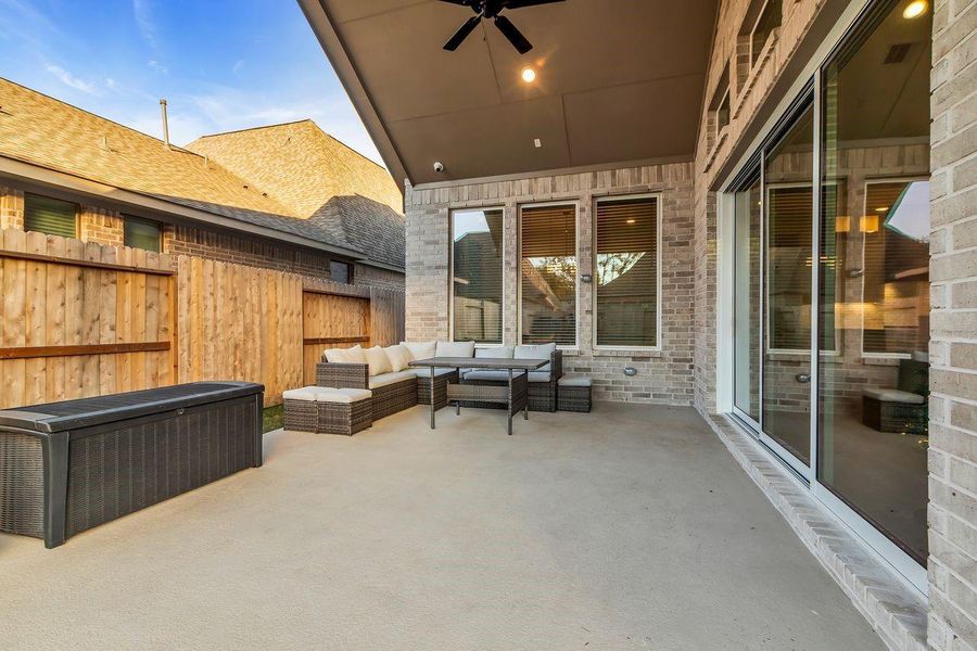 Exterior details and patio area of a home in The Highlands - 65', Porter (Image 4). Exterior details and patio area of a home in The Highlands - 65', Porter (Image 4).