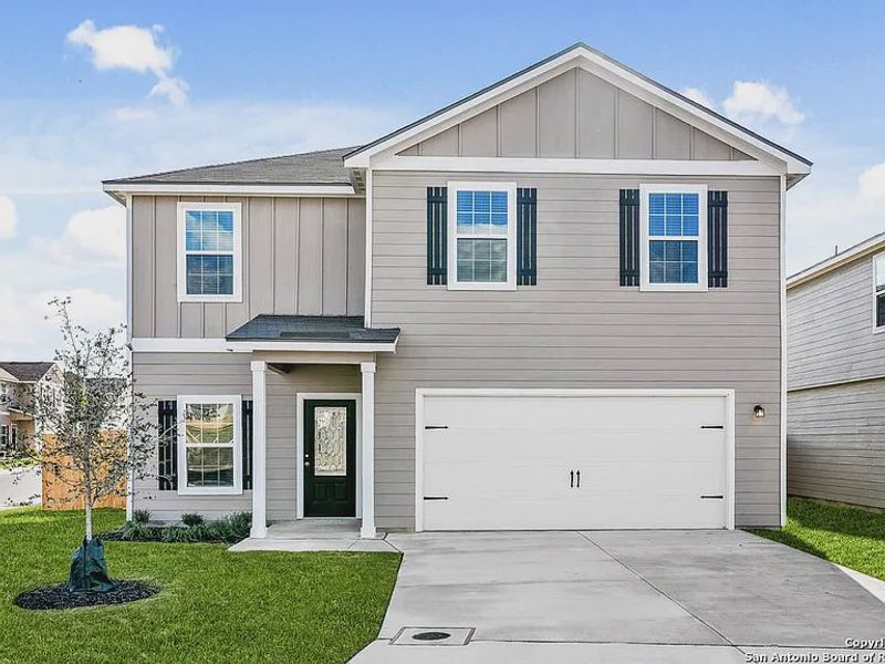 Front exterior of a new home in Savannah Place, San Antonio, TX, highlighting curb appeal (Image 2).
