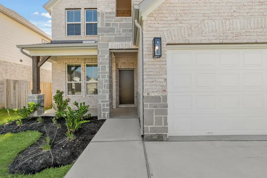 Front exterior of a new home in Morton Creek Ranch, Katy, TX, highlighting curb appeal (Image 2). Front exterior of a new home in Morton Creek Ranch, Katy, TX, highlighting curb appeal (Image 2).