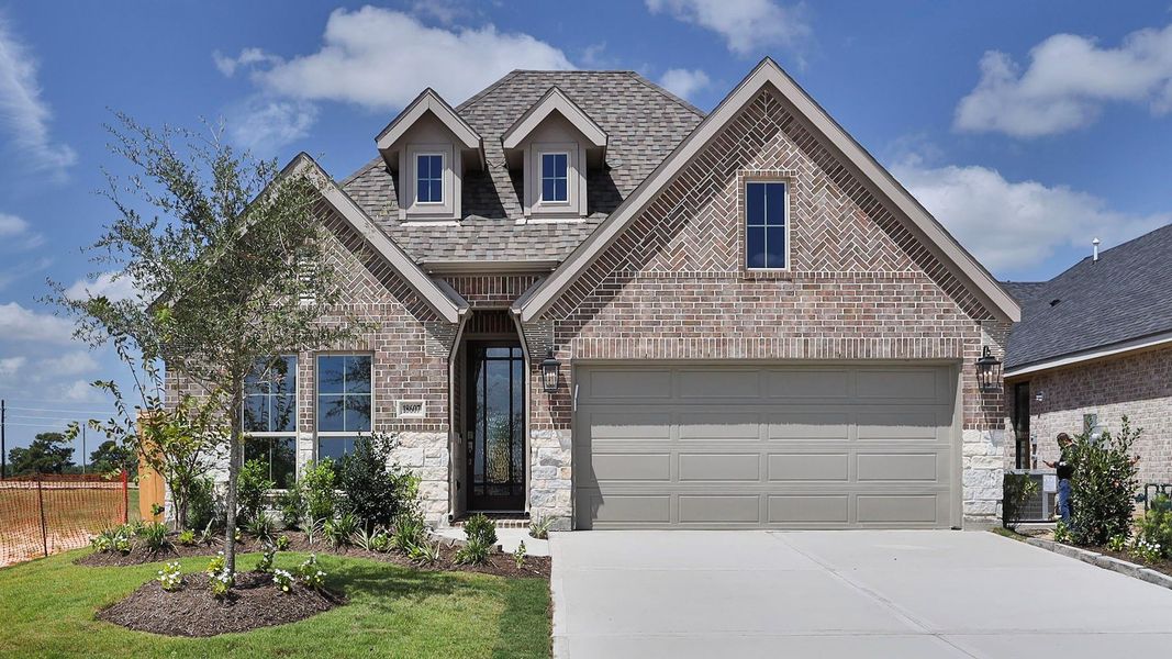 Front exterior of a new home in Everly, Hockley, TX, highlighting curb appeal (Image 16).