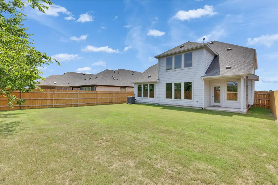 Back of house with roof with shingles and central AC unit Back of house with roof with shingles and central AC unit